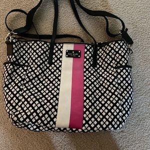 Kate Spade Diaper bag. Lots of pockets. Comes with changing pad.